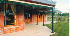 House with Haddonstone paved verandah